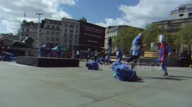 Actors stage a fight in Trafalgar Square