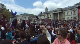 A crucifix is carried through Trafalgar Square on Good Friday