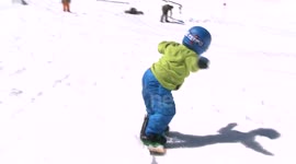 Four-year-old boy with amazing snowboarding skills