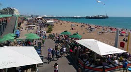 Busy Brighton beach front on a summers day - 4K