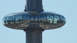 Brighton hot day i360 Zoom out to reveal beach front