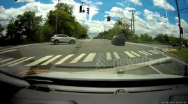 Driver runs red light and gets hit by oncoming vehicle