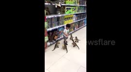 Boy gets scared when surrounded by toy dinosaurs