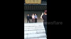 Woman's dentures fall out as she poses for photo