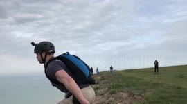 Daredevils jump off Britain's most notorious suicide spot