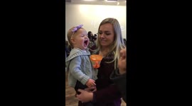 Baby catches food in mouth like a pro and gets excited