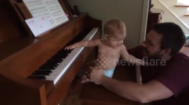 Baby really gets into playing the piano