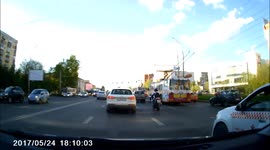 Taxi driver appears to lose control of vehicle and ram motorbike