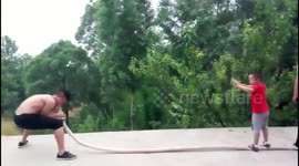 Kung fu master inflates balloons through extinguishing pipe