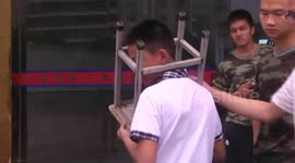 Boy gets head stuck between stool legs in southeastern China