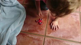 Two year old happy out playing with fidget spinner