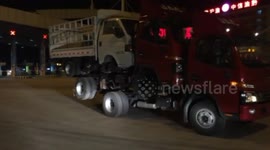 Lorry transports two lorries piling up on it on motorway