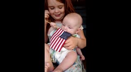 Cute baby waving his american flag