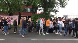 Fans Gather Outside Old Traffor Cricket Ground for One Love Manchester Concert. Armed Police Supervise.