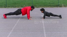 Inspirational father-daughter moment as dad teaches seven-year-old how to do pushups