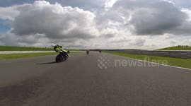Motorcyclist crashes after being knocked out by flying debris