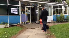 Early voter queues for Polling Station to open