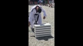 Bosnian teenager smashes blocks with head to break record