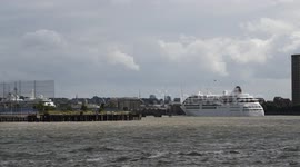 Silversea cruise ships pass each other on the Thames near Greenwich