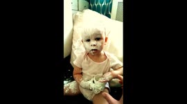 Baby covers herself in nappy cream while mum is not watching