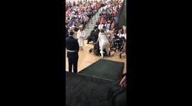 Woman born with cerebral palsy walks to stage during graduation ceremony