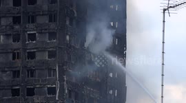 Sprinkler outside Grenfell Tower as seen from Avondale Park Gardens