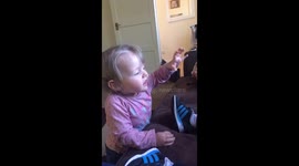 Laughing eating crisps