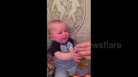 Eight-month-old baby loves beer