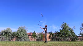 Juggling three knives and three balls at the same time