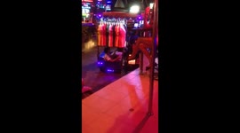 SHOCKING moment two thai children go to work with their parents in the back of a moped.