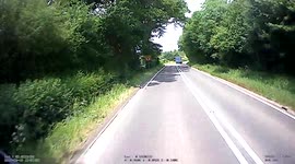 Little red car pulls out on 32 tonne lorry