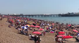 Thousands gather on Brighton beach on hottest day of the year