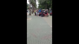 Thai police have a big pay day when they stop and fine 8 tourists riding to the beach.