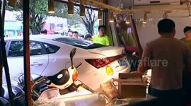 Three people injured after car reverses into shop in China