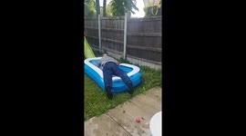 Man pushes daughter out of way and flops into paddling pool amid heatwave