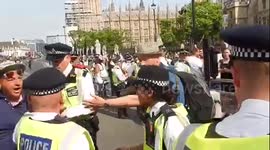 Photographer grabbed by police at Grenfell Tower fire protest