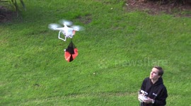 Dad uses drone to launch toy parachute