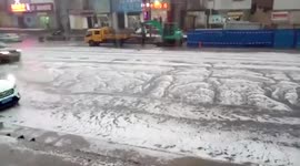 Hail storm brings flooding to central China