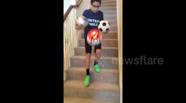 Kid juggles a soccer ball up an entire flight of stairs like a boss