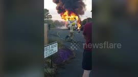 Minibus explodes into flames on quiet street