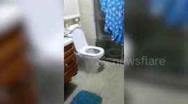 Toilet floods bathroom during storm in China
