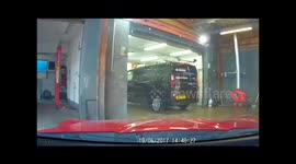Dash-cam records car mechanic appreciating air conditioning on hot day