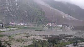 More than 140 people are feared buried alive after torrential rain touched off a landslide in southwestern China