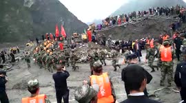 Hundreds of rescuers search for missing people after major landslide in China