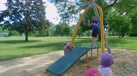 Old girl Zip Lining In a Children's Park