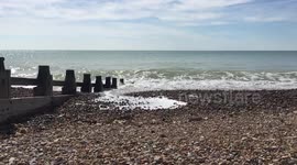 Slow motion waves crashing British coast