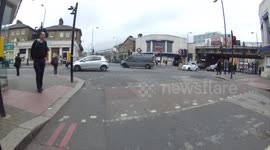 Bike crash ends up with bike embedded in the front of the car
