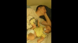 Daddy falls asleep while taking care of baby
