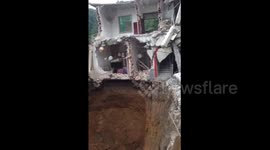 Woman missing after sinkhole opens under house in China