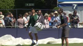 Djokovic poses for pictures ahead of Wimbledon warm-up